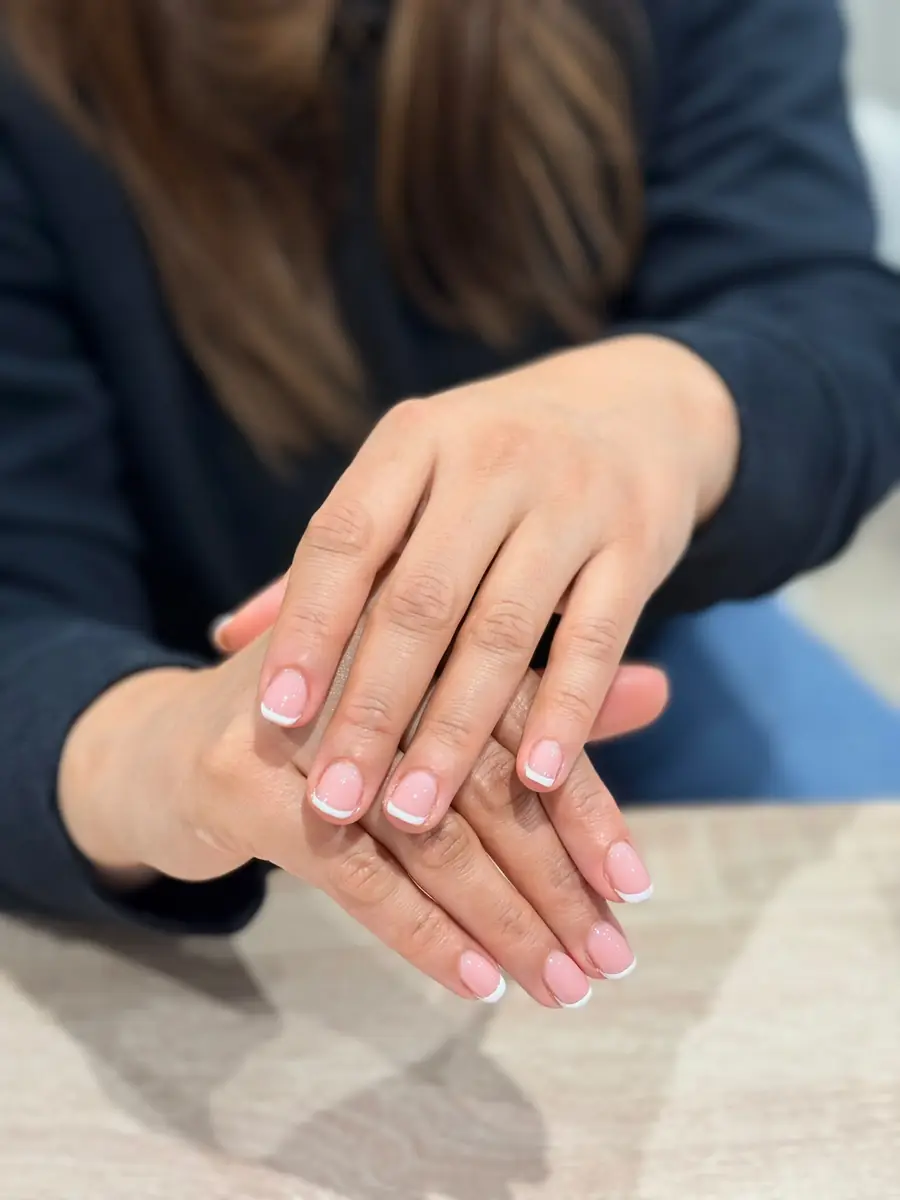 Soft pink French gel nails